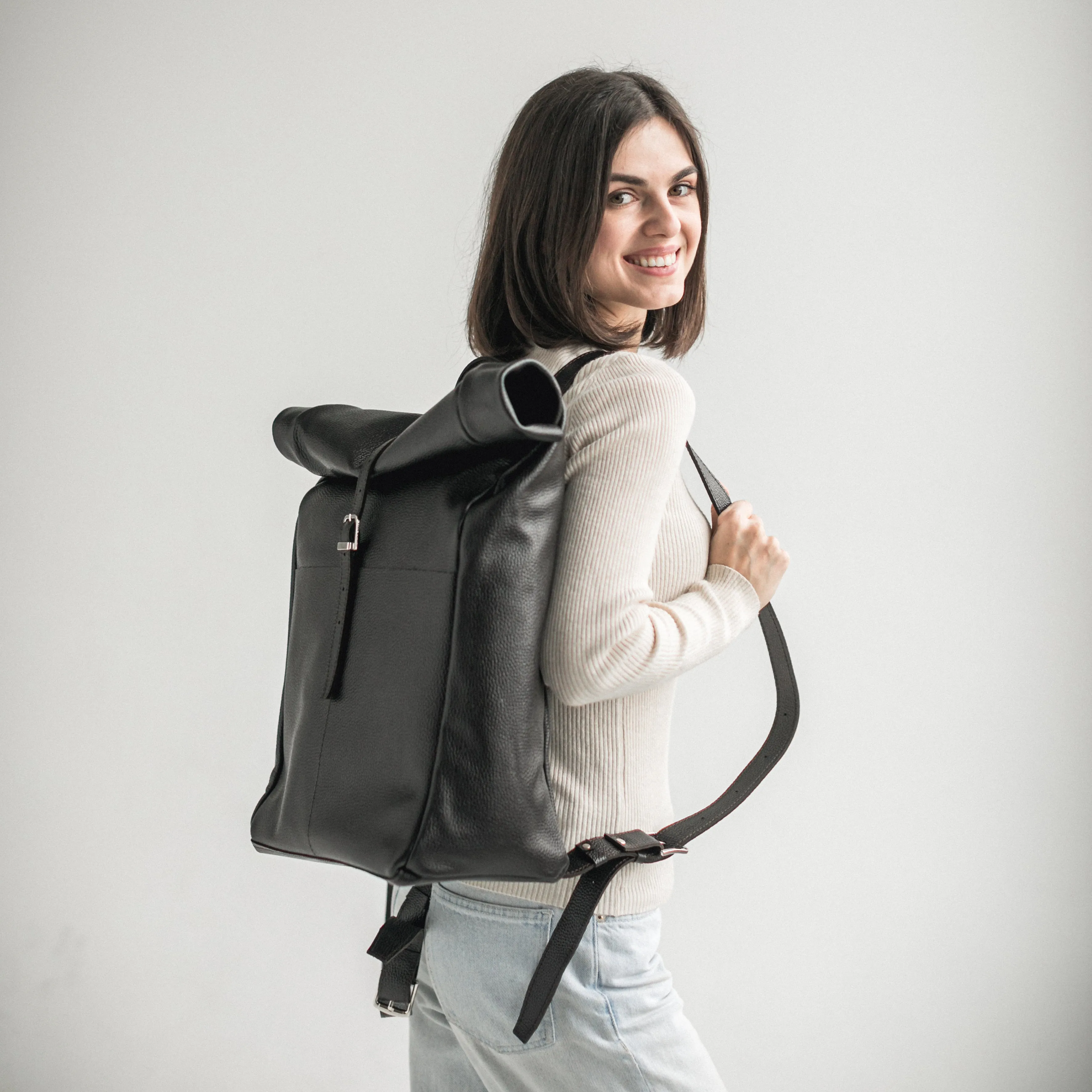 Black pebbled leather roll-top backpack